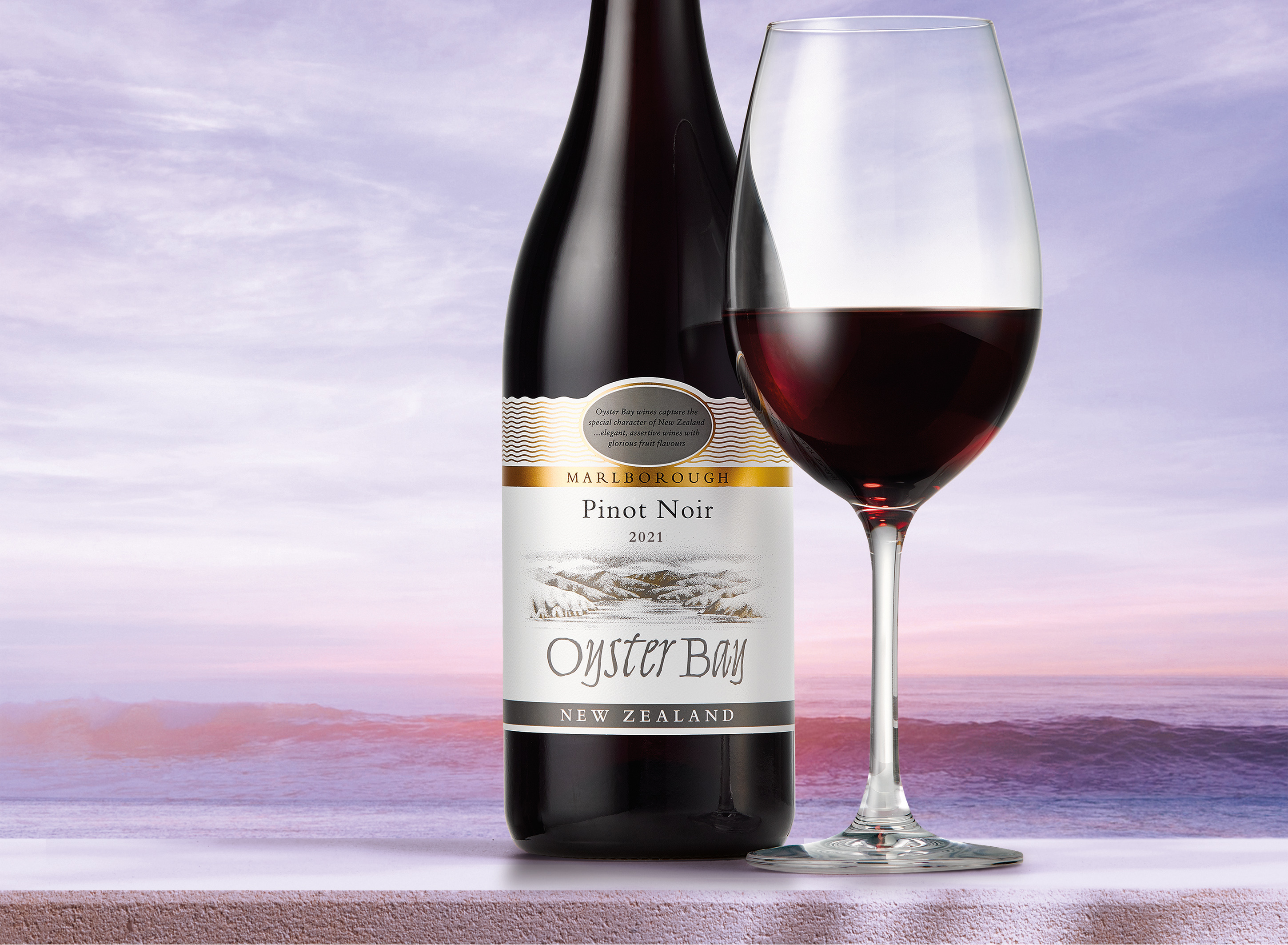 Oyster Bay Marlborough New Zealand Pinot Noir Wine bottle next to full glass