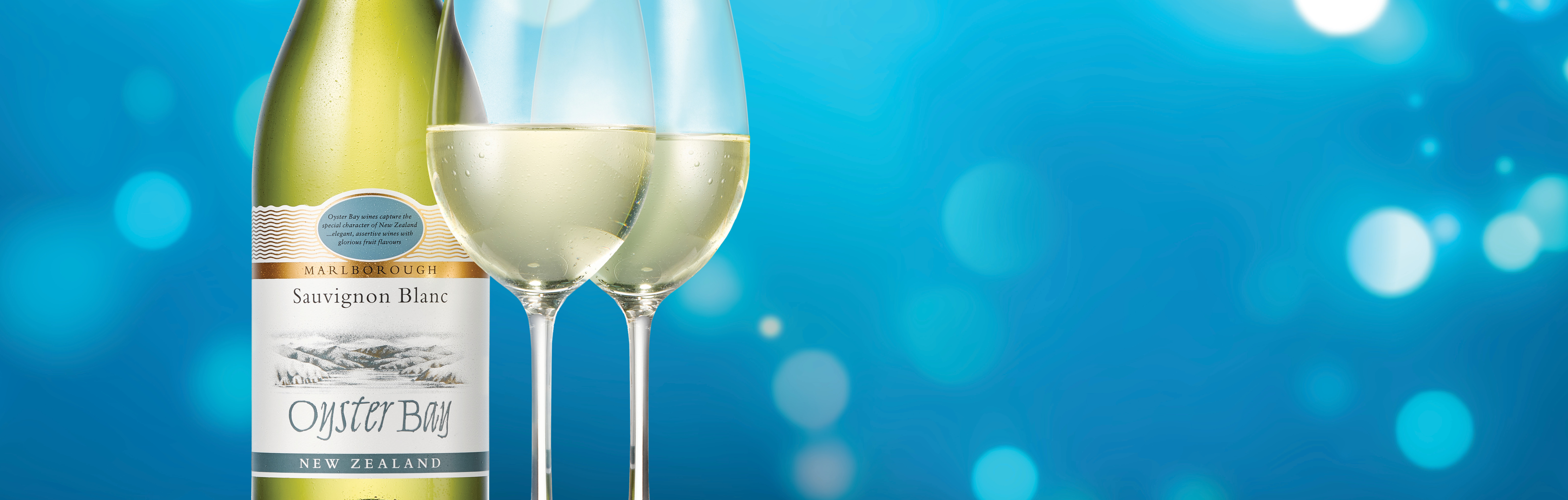Oyster Bay Sauvignon Blanc bottle with two glasses
