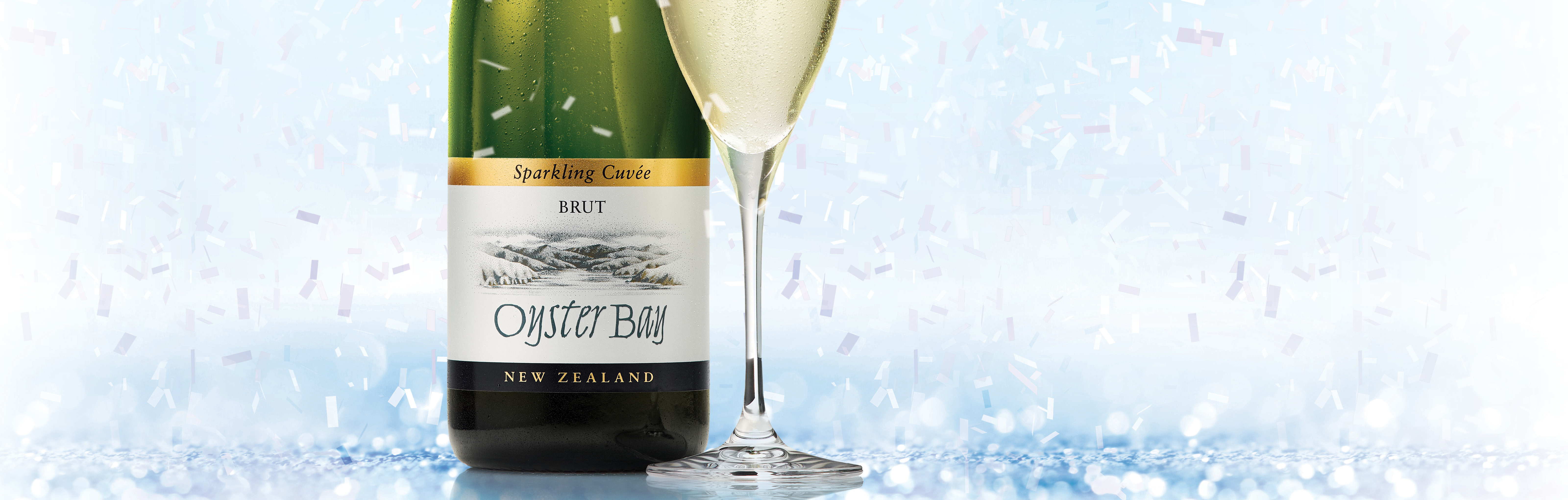 Oyster Bay Sparkling Cuveé Brut bottle with glass